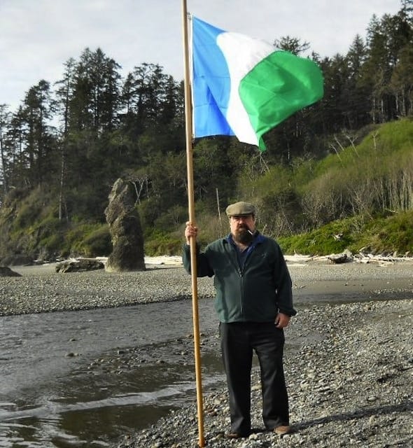 Harold Covington with the flag